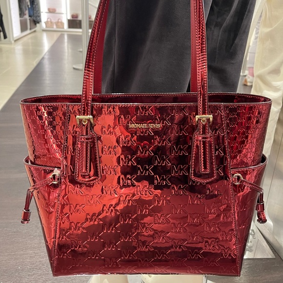 MICHAEL KORS Voyager Lg Metallic Logo Debossed EW Shoulder Tote Bag
Cherry 
NWT - Picture 5 of 16